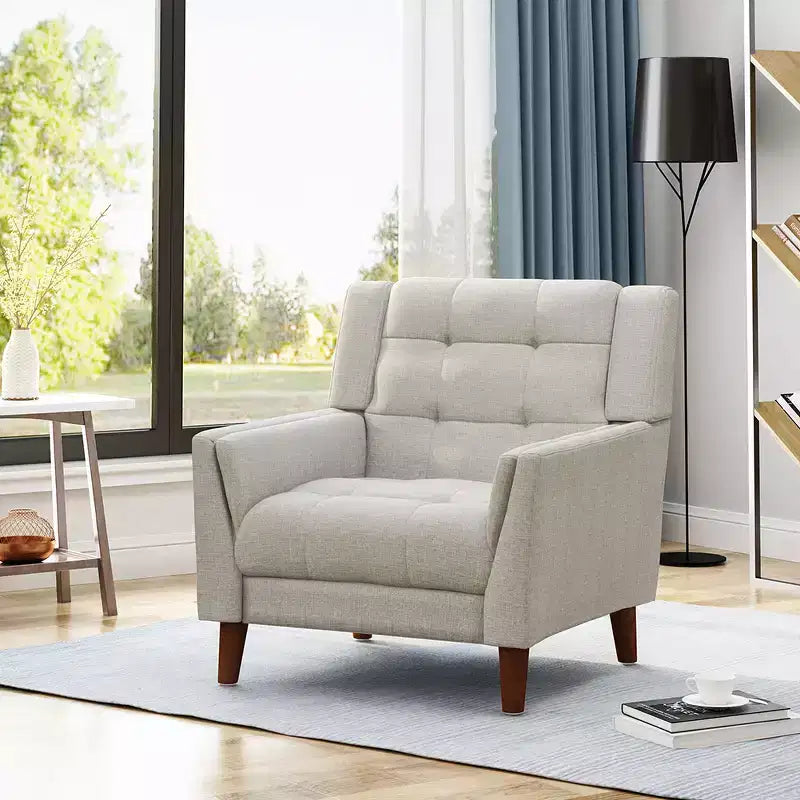 Fauteuil capitonné beige avec pieds en bois, une place